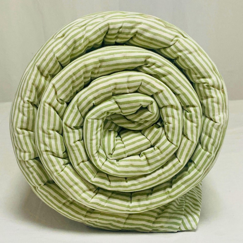 Green Stripe Kantha Quilt showing both sides with bold green stripes, handcrafted from 100% cotton, perfect as a King or Queen bedspread, throw, or coverlet, ideal for boho, farmhouse, and Indian-inspired home décor. Close-up of the hand block printed green stripes on the Kantha quilt, highlighting artisanal craftsmanship, soft cotton texture, and reversible design for modern and rustic bedroom styling.