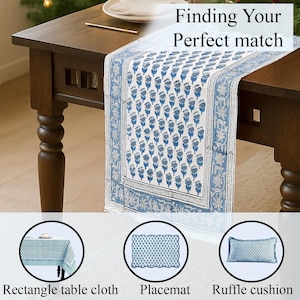 Image of a wooden dining table decorated with a blue and white floral hand block printed cotton table runner with intricate border design. Text reads “Finding Your Perfect Match.” Below, three coordinating products are shown in circles: a rectangle table cloth, a placemat, and a ruffle cushion, all in matching blue hand block print patterns.