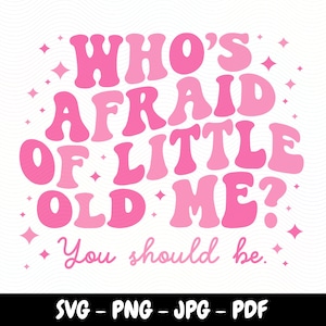 May include: Pink and white graphic design with the text "WHO'S AFRAID OF LITTLE OLD ME? You should be." in a retro font style. The design is surrounded by small pink stars.