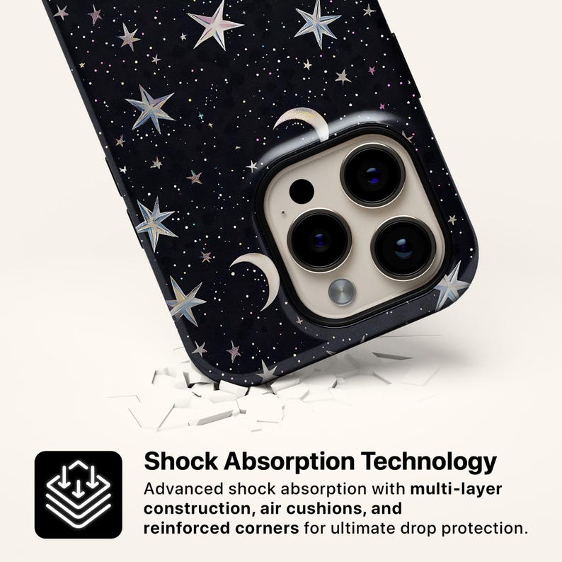 May include: A black phone case with a celestial design featuring stars and crescent moons. The case has a glossy finish and a camera cutout. The text on the image reads "Shock Absorption Technology" and describes the case's protective features.