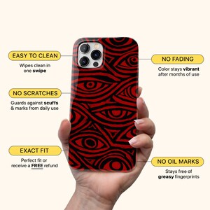 Puede incluir: Funda de tel&eacute;fono con un patr&oacute;n de ojos rojos y negros. La funda tiene el siguiente texto: "EASY TO CLEAN", "NO FADING", "NO SCRATCHES", "EXACT FIT" y "NO OIL MARKS".