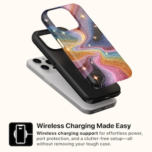 May include: A smartphone with a black case and a colorful, swirling galaxy design. The case is layered over a black phone case and a silver phone. The text "Wireless Charging Made Easy" is displayed.