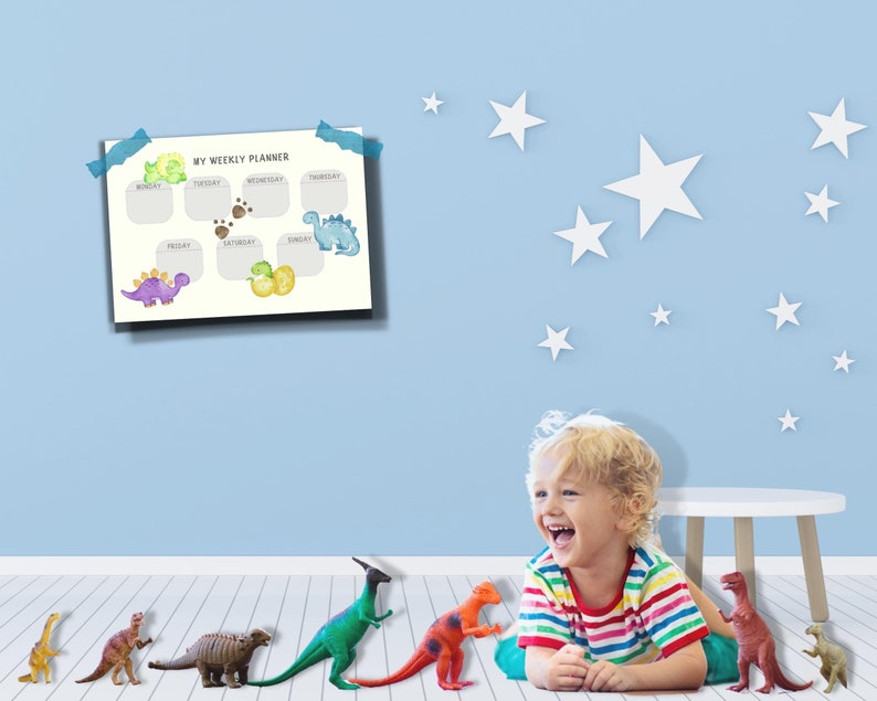 May include: A child plays with dinosaur toys in a room with a blue wall and white stars. A weekly planner with a dinosaur theme is on the wall. The planner has the days of the week listed and space for writing.