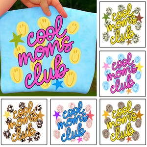May include: Light blue t-shirt with the text "cool moms club" in pink script. The shirt features yellow smiley faces, green and blue stars. The design is repeated on other shirts.