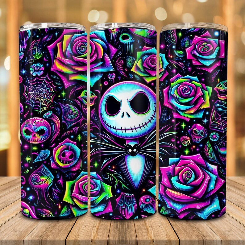 May include: A black and white tumbler with a neon pink, green, and blue design featuring a skull, roses, and the character Jack Skellington from the movie The Nightmare Before Christmas.