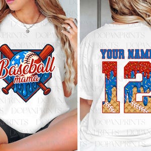 May include: White t-shirt with a baseball-themed design. The front features a baseball graphic with the text "Baseball mama" and crossed bats. The back has the text "YOUR NAME" above the number "12" with a baseball-themed design.