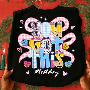 May include: A set of three ceramic mugs with a speckled, matte finish. The mugs are in shades of cream, light gray, and dark gray. Each mug has a simple, minimalist design, perfect for coffee or tea.