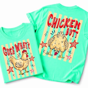 May include: Two light green t-shirts with chicken-themed graphics. One shirt says "GUES WHAT?" with a cartoon chicken. The other says "CHICKEN BUTT" with a chicken's rear end. Both shirts have red stars and yellow stripes.