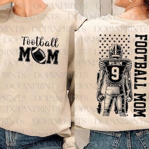 May include: A beige sweatshirt with the text "Football Mom" and a football graphic on the front. The back of the sweatshirt features a black and white illustration of a football player with the text "Football Mom" and a star-spangled banner.