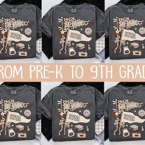 May include: A charcoal gray t-shirt featuring a graphic print of two pennant flags, one with a leopard print and one with a checkered pattern. The flags display the name Sophia and various grade levels. Additional icons include a backpack, books, and a pencil case.