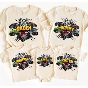 May include: Beige family matching t-shirts and a onesie with a monster truck design. Each shirt has a different name: Daddy, Mommy, Brother, Sister, and Xavier. The design includes checkered flags and colorful monster trucks.