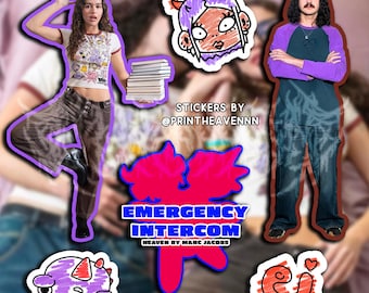 May include: A set of colorful stickers featuring cartoon characters and text. The stickers include a pink and blue cartoon character with a purple mohawk, a pink and blue cartoon character with a red heart, a purple cartoon character with a horn, and a pink and blue cartoon character with the text "Emergency Intercom Heaven by Marc Jacobs".