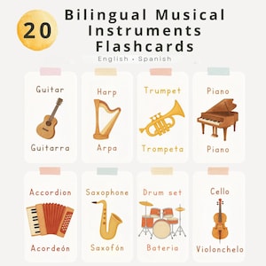 Op de afbeelding: Educatieve flashcards met illustraties van muziekinstrumenten, waaronder een gitaar, harp, trompet, piano, accordeon, saxofoon, drumstel en cello. De kaarten zijn in het Engels en Spaans.