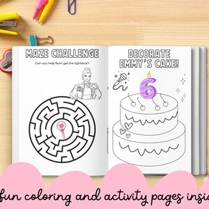 May include: Open activity book with two pages. One page features a maze with the text "MAZE CHALLENGE" and a drawing of a person. The other page shows a two-tiered cake with the text "DECORATE EMMY'S CAKE!" and a number 6 candle. Text at the bottom reads "12 fun coloring and activity pages inside!"
