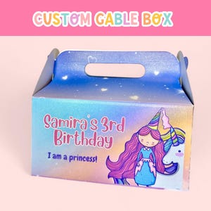 May include: A blue and purple gable box with a unicorn and a girl wearing a crown and a blue dress. The box says "Samira's 3rd Birthday I am a princess!"