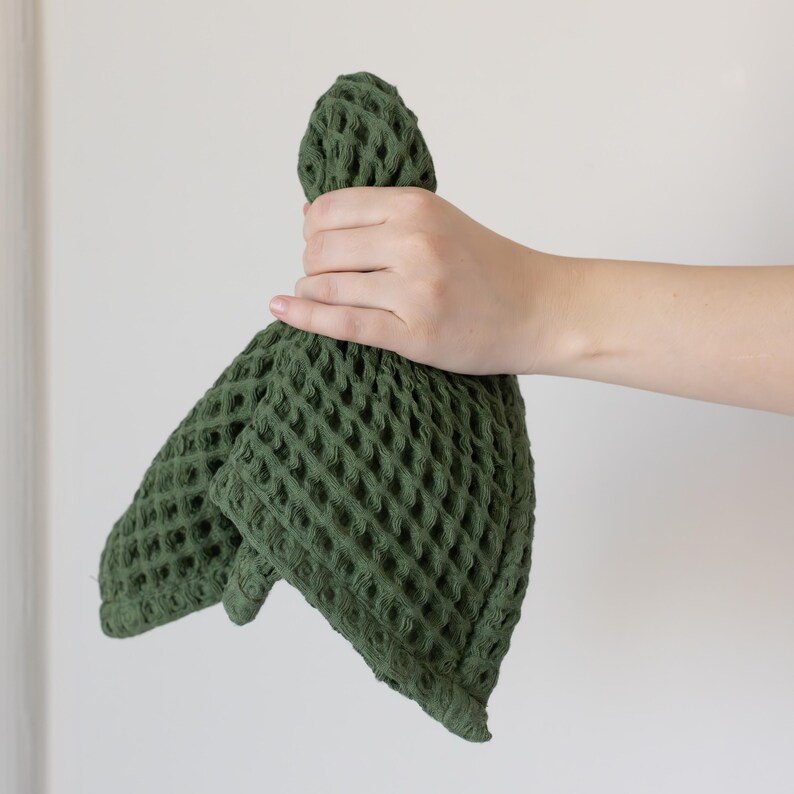 Hand holding soft soft waffle washcloth showing honeycomb texture — waffle face towel washcloth in OEKO-TEX Turkish cotton