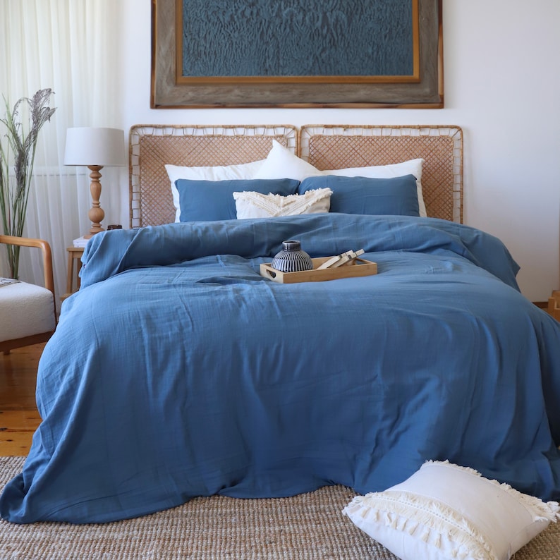 Turkish cotton muslin duvet cover draped over bed showing lightweight drape and natural texture