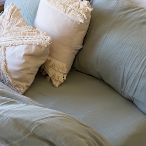 Muslin duvet cover set folded in kraft paper packaging, gift-ready presentation