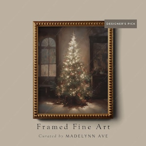 Unframed art print titled Tannenbaum, featuring a vintage-style Christmas tree glowing with lights in a softly lit room, presented with an antique-style gold frame.