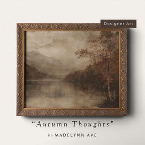 May include: A framed painting of a misty lake scene with mountains in the background. The lake is calm and reflective, and the trees on the shore are a mix of green and brown. The painting is titled "Autumn Thoughts" by Madelynn Ave.