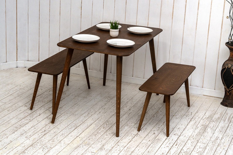 🍽️ Space Saving Rectangle Narrow Small Dining Table Set – Walnut Wood Bench & Stool Kitchen Set

Maximize your space without compromising style with this rectangle small dining table set. Crafted from warm walnut wood, this wooden dine table set combines modern minimalist design with rustic charm, making it perfect for small kitchens, breakfast nooks, and dining areas.

✨ Why You’ll Love It:

Sleek and minimalist rectangular dining table blends modern aesthetics with handcrafted warmth.