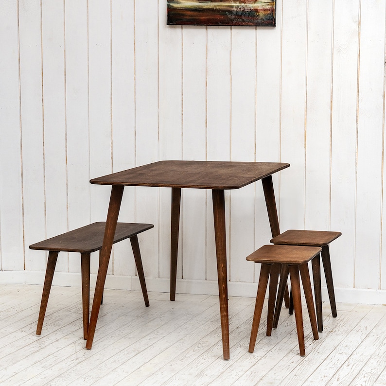 🍽️ Space Saving Rectangle Narrow Small Dining Table Set – Walnut Wood Bench & Stool Kitchen Set

Maximize your space without compromising style with this rectangle small dining table set. Crafted from warm walnut wood, this wooden dine table set combines modern minimalist design with rustic charm, making it perfect for small kitchens, breakfast nooks, and dining areas.

✨ Why You’ll Love It:

Sleek and minimalist rectangular dining table blends modern aesthetics with handcrafted warmth.