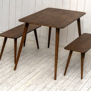 Here is Kitchen Small Walnut Wooden Dining Table Set! This Farmhouse Narrow Dine Table Benches in the dining room perfectly complements and change the cozy home atmosphere, offering a personalized touch to the kitchen.