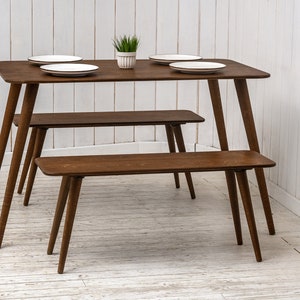 Here is Kitchen Small Walnut Wooden Dining Table Set! This Farmhouse Narrow Dine Table Benches in the dining room perfectly complements and change the cozy home atmosphere, offering a personalized touch to the kitchen.
