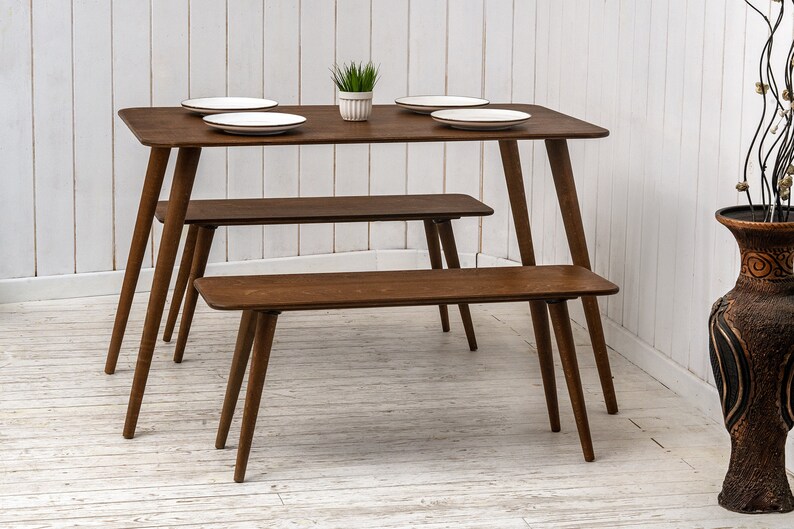 Here is Kitchen Small Walnut Wooden Dining Table Set! This Farmhouse Narrow Dine Table Benches in the dining room perfectly complements and change the cozy home atmosphere, offering a personalized touch to the kitchen.