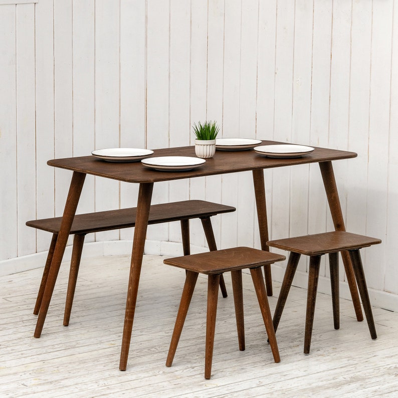 🍽️ Space Saving Rectangle Narrow Small Dining Table Set – Walnut Wood Bench & Stool Kitchen Set

Maximize your space without compromising style with this rectangle small dining table set. Crafted from warm walnut wood, this wooden dine table set combines modern minimalist design with rustic charm, making it perfect for small kitchens, breakfast nooks, and dining areas.

✨ Why You’ll Love It:

Sleek and minimalist rectangular dining table blends modern aesthetics with handcrafted warmth.