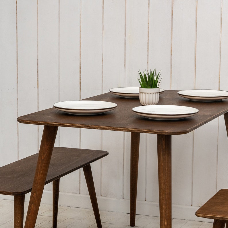 🍽️ Space Saving Rectangle Narrow Small Dining Table Set – Walnut Wood Bench & Stool Kitchen Set

Maximize your space without compromising style with this rectangle small dining table set. Crafted from warm walnut wood, this wooden dine table set combines modern minimalist design with rustic charm, making it perfect for small kitchens, breakfast nooks, and dining areas.

✨ Why You’ll Love It:

Sleek and minimalist rectangular dining table blends modern aesthetics with handcrafted warmth.