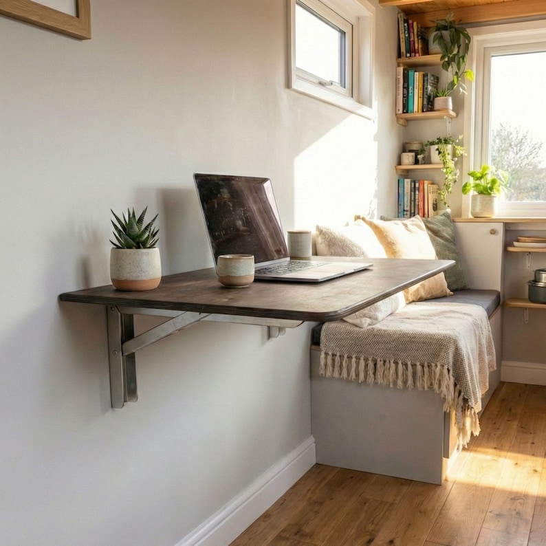 Wall Mounted Foldable Home Office Desk Table

Fold-Down Space Saving Laptop Desk | Murphy Desk for Small Spaces, Kitchen, RV & Dorm Rooms

This wall-mounted foldable desk is a smart and stylish space-saving solution for modern homes. Designed for versatility, it folds down easily when you need a workspace and folds back up to keep your area clean and open. Perfect for home offices, kitchens, RVs, dormitories, and studio apartments.

The tabletop is crafted from high-quality birch plywood,