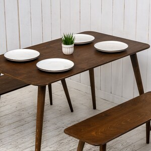 Here is Kitchen Small Walnut Wooden Dining Table Set! This Farmhouse Narrow Dine Table Benches in the dining room perfectly complements and change the cozy home atmosphere, offering a personalized touch to the kitchen.