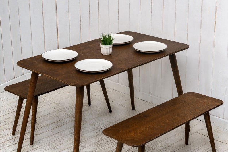Here is Kitchen Small Walnut Wooden Dining Table Set! This Farmhouse Narrow Dine Table Benches in the dining room perfectly complements and change the cozy home atmosphere, offering a personalized touch to the kitchen.