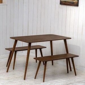 Here is Kitchen Small Walnut Wooden Dining Table Set! This Farmhouse Narrow Dine Table Benches in the dining room perfectly complements and change the cozy home atmosphere, offering a personalized touch to the kitchen.