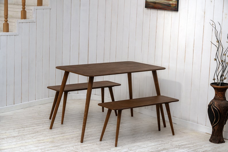 Here is Kitchen Small Walnut Wooden Dining Table Set! This Farmhouse Narrow Dine Table Benches in the dining room perfectly complements and change the cozy home atmosphere, offering a personalized touch to the kitchen.