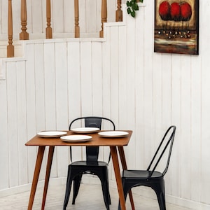 Here is Square Walnut Wooden Dining Room Table! This Narrow Space Dine Table Kitchen in the dining room perfectly complements and change the cozy small home atmosphere, offering a personalized touch to the kitchen.