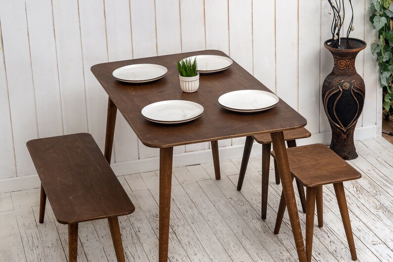 🍽️ Space Saving Rectangle Narrow Small Dining Table Set – Walnut Wood Bench & Stool Kitchen Set

Maximize your space without compromising style with this rectangle small dining table set. Crafted from warm walnut wood, this wooden dine table set combines modern minimalist design with rustic charm, making it perfect for small kitchens, breakfast nooks, and dining areas.

✨ Why You’ll Love It:

Sleek and minimalist rectangular dining table blends modern aesthetics with handcrafted warmth.
