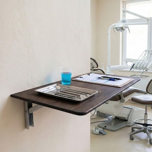 Wall Mounted Foldable Home Office Desk Table

Fold-Down Space Saving Laptop Desk | Murphy Desk for Small Spaces, Kitchen, RV & Dorm Rooms

This wall-mounted foldable desk is a smart and stylish space-saving solution for modern homes. Designed for versatility, it folds down easily when you need a workspace and folds back up to keep your area clean and open. Perfect for home offices, kitchens, RVs, dormitories, and studio apartments.

The tabletop is crafted from high-quality birch plywood,