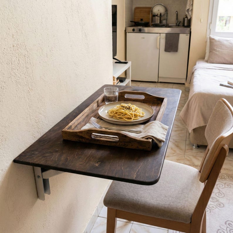 Wall Mounted Foldable Home Office Desk Table

Fold-Down Space Saving Laptop Desk | Murphy Desk for Small Spaces, Kitchen, RV & Dorm Rooms

This wall-mounted foldable desk is a smart and stylish space-saving solution for modern homes. Designed for versatility, it folds down easily when you need a workspace and folds back up to keep your area clean and open. Perfect for home offices, kitchens, RVs, dormitories, and studio apartments.

The tabletop is crafted from high-quality birch plywood,