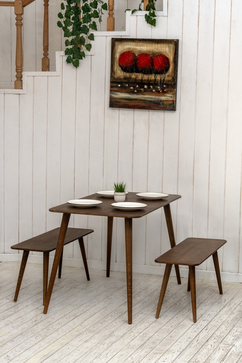 Here is Kitchen Small Walnut Wooden Dining Table Set! This Farmhouse Narrow Dine Table Benches in the dining room perfectly complements and change the cozy home atmosphere, offering a personalized touch to the kitchen.