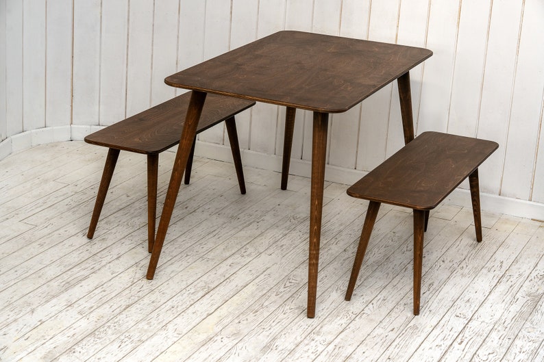 Here is Kitchen Small Walnut Wooden Dining Table Set! This Farmhouse Narrow Dine Table Benches in the dining room perfectly complements and change the cozy home atmosphere, offering a personalized touch to the kitchen.