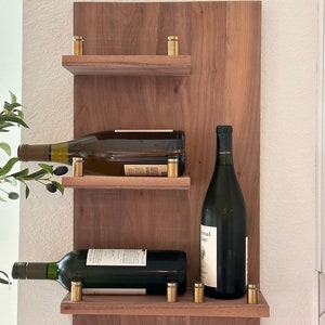 Wall Mounted Wine Rack.  Walnut, Red Oak, Cherry. Holds 4,5,6 bottles. Finished/Unfinished. Brass, Nickel, or Black studs