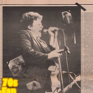 May include: A black and white newspaper article with the headline "60s & 70s Music-Fan". The article discusses the music of the 1960s and 1970s and includes a quote from a musician. The article is from a magazine.