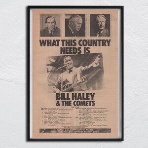 May include: Framed vintage poster featuring Bill Haley & The Comets. The poster includes the text "WHAT THIS COUNTRY NEEDS IS" and a concert schedule. The image is in black and white.