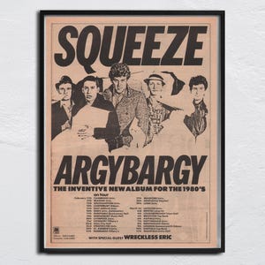 May include: A framed vintage poster for the band Squeeze, promoting their album "Argybargy" and tour. The poster features a sepia-toned image of the band members and tour dates. The text "The Inventive New Album for the 1980's" is also visible.
