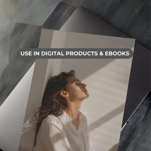 May include: A woman with long brown hair is lying down with her eyes closed. She is wearing a white shirt and is illuminated by natural light. The text "USE IN DIGITAL PRODUCTS & EBOOKS" is displayed at the top of the image.