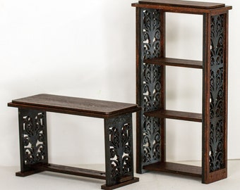 May include: Two wooden shelves with intricate black floral designs on the sides. The shelves are made of dark wood and have three shelves.