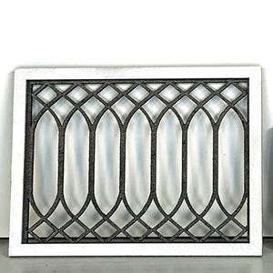 May include: A rectangular wall decor piece featuring a thick white frame surrounding a dark gray metal insert. The insert displays a repeating pattern of elongated vertical oval shapes intersected by a diamond grid at the top and bottom edges.