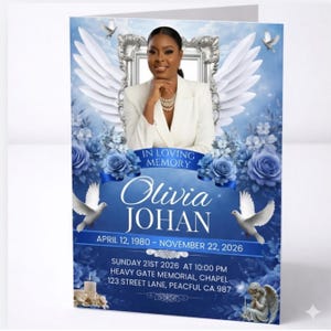 Peut inclure: Carte de deuil avec le portrait d'une femme en blazer blanc, sur fond bleu avec des ailes d'ange et des roses. La carte indique "In Loving Memory" et comprend le nom "Olivia Johan" avec les dates de naissance et de d&eacute;c&egrave;s.